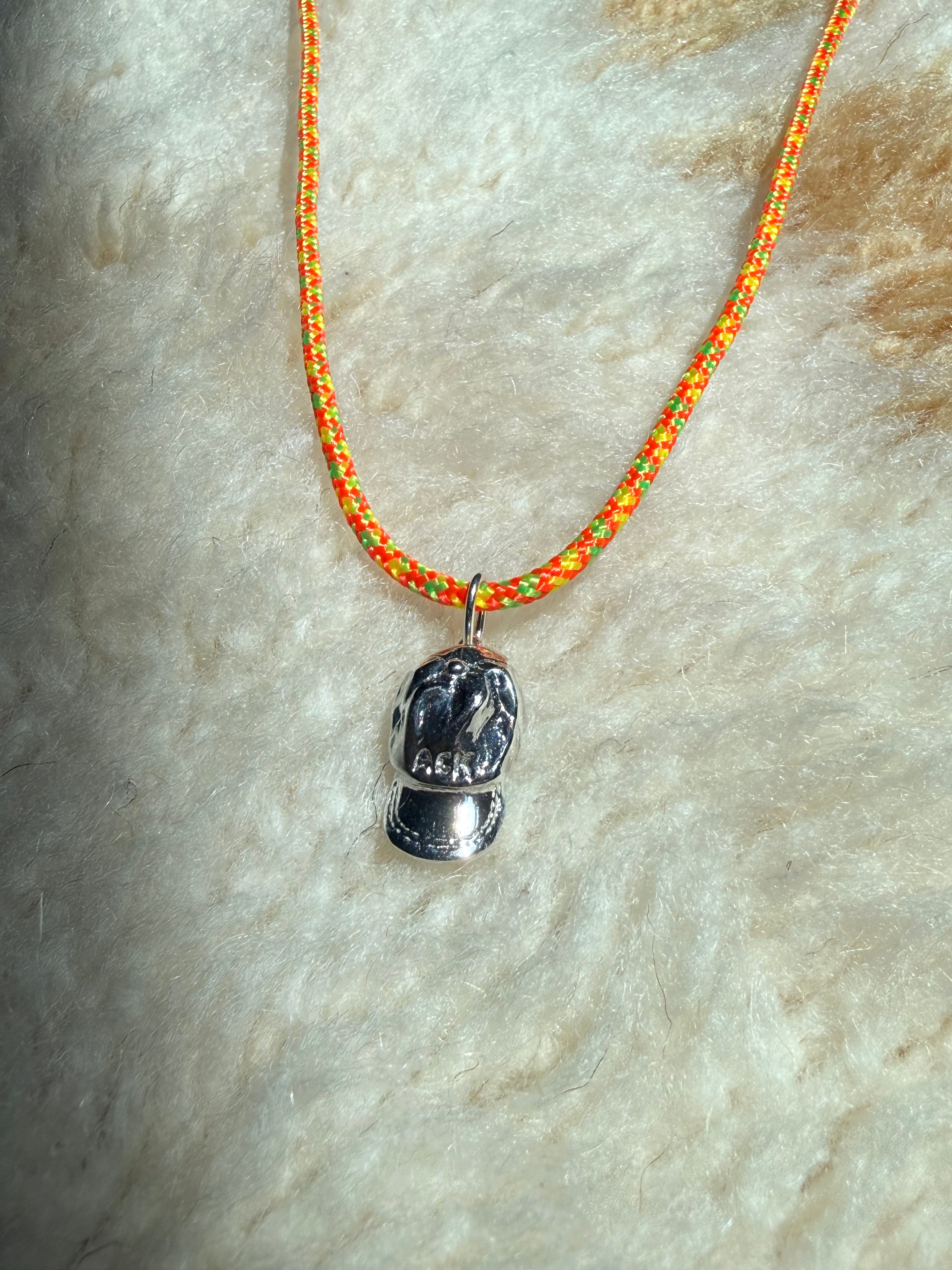 a salty ACK hat necklace