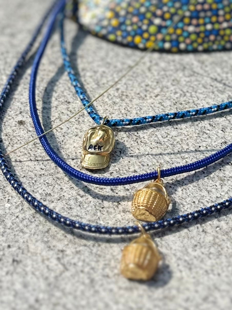 a salty ACK hat necklace