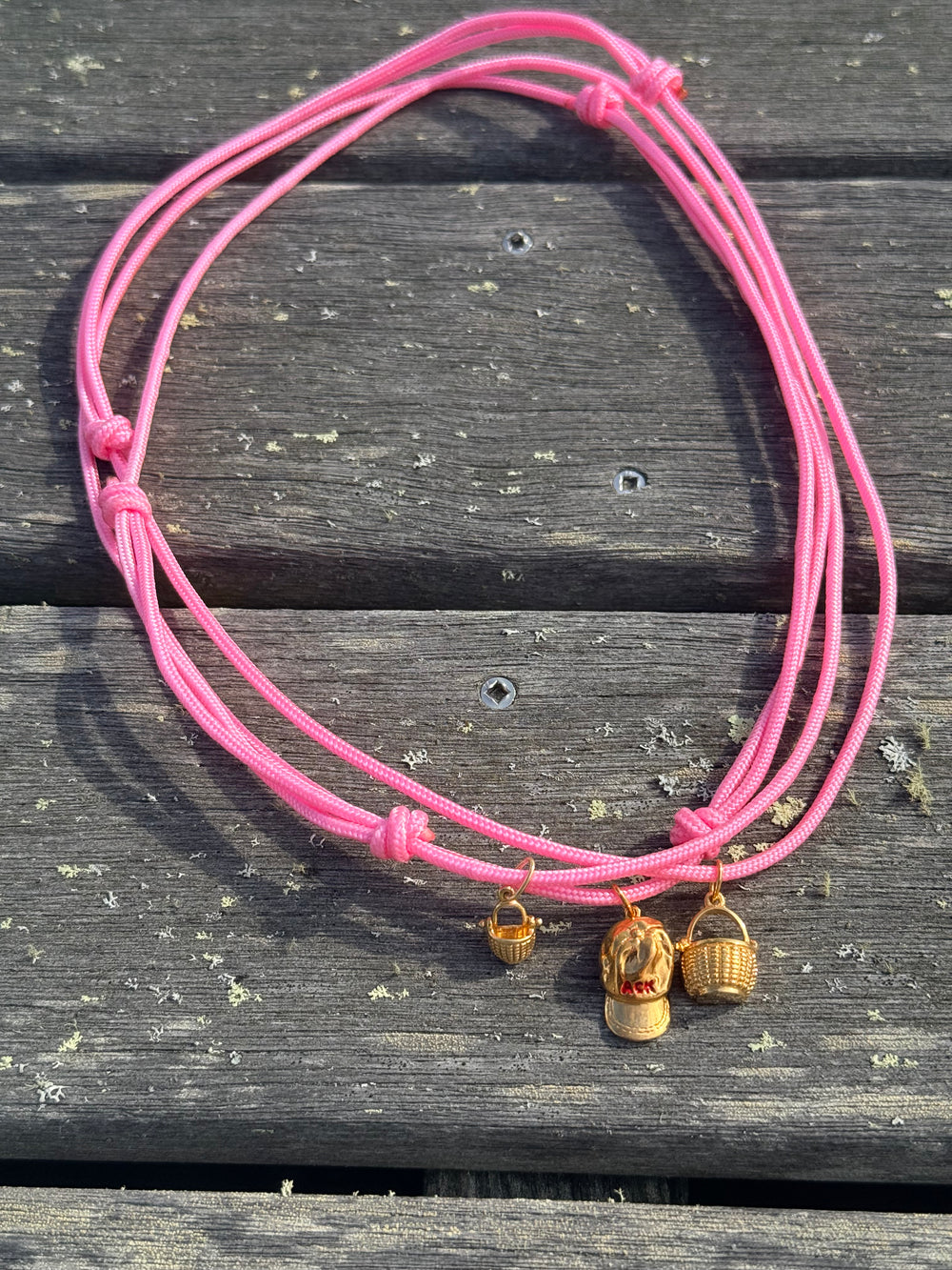 a salty ACK hat necklace