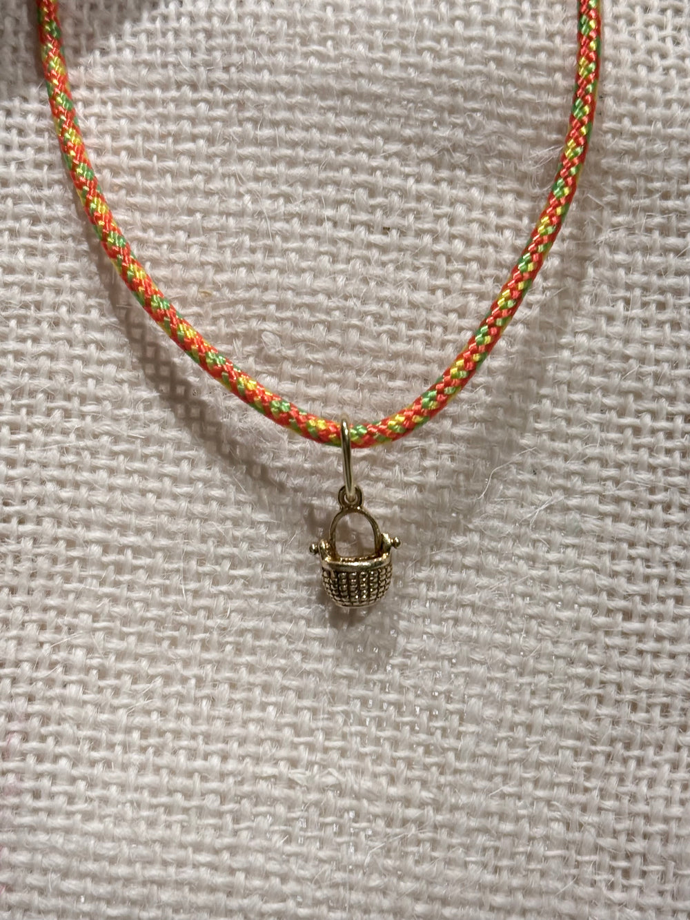 a tiny nantucket basket necklace