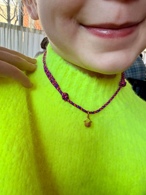 a tiny nantucket basket necklace
