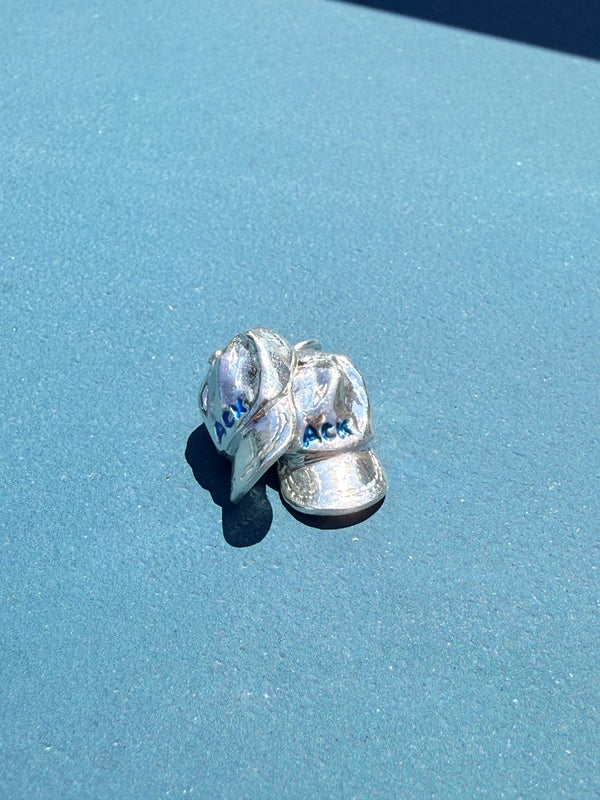 a salty ACK hat necklace