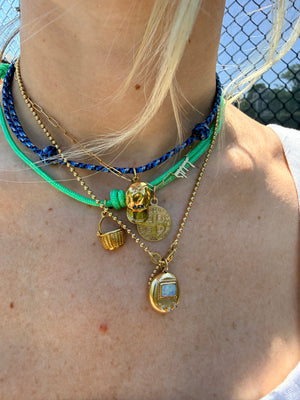 a salty ACK hat necklace