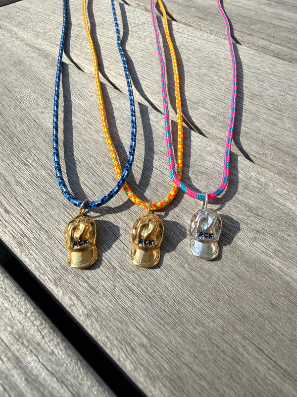 a salty ACK hat necklace