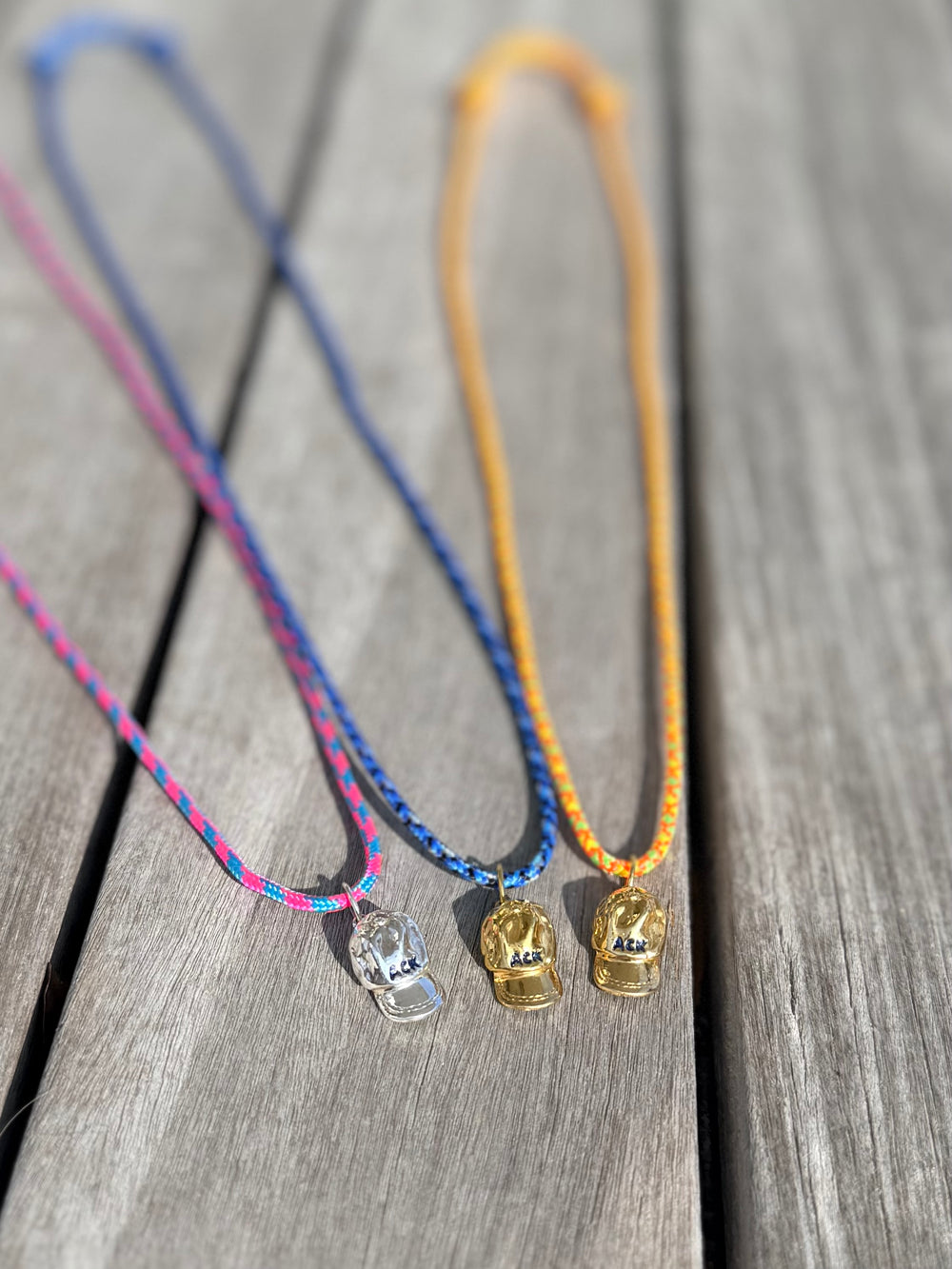 a salty ACK hat necklace