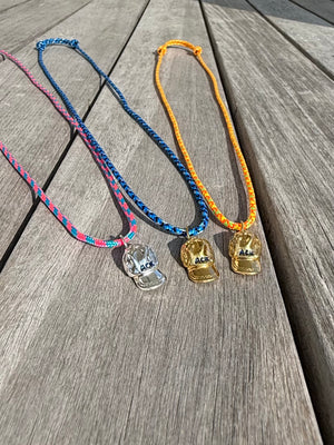 a salty ACK hat necklace