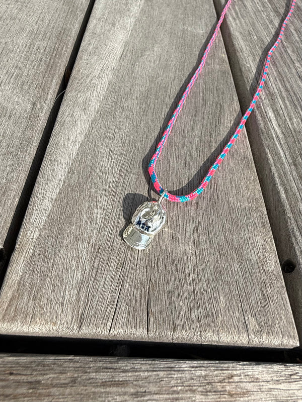 a salty ACK hat necklace