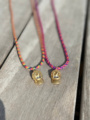 a salty ACK hat necklace