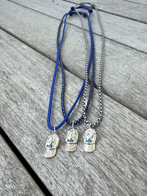 a salty ACK hat necklace