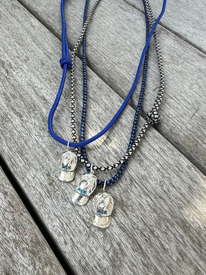 a salty ACK hat necklace