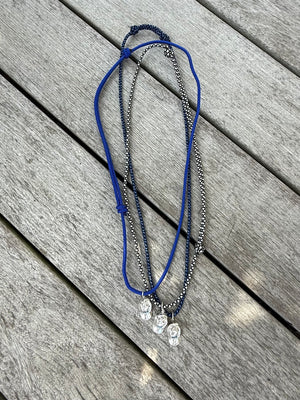 a salty ACK hat necklace