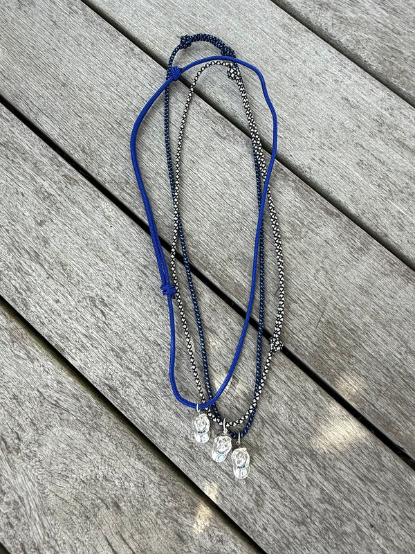 a salty ACK hat necklace